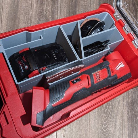 Oscillating multi-tool kit organizer layout with blades, charger, and accessories